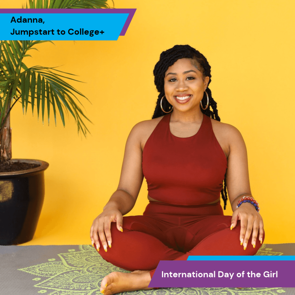 Adanna sits cross-legged on a yoga mat against a yellow background. Text overlays read Adanna, Jumpstart to College+ and International Day of the Girl.